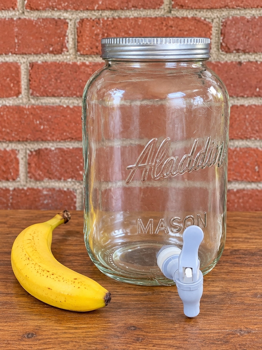 Mason Glass Beverage Dispenser with Silver Lid and White Spigot